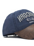 Casquette de baseball brodée à panneaux en cuir PU